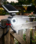 Ultra Bright Solar Motion Light Outdoor Waterproof Security Spotlight Motion Activated With Flexible Tripod Aluminum Floodlight mounted on a fence.
