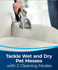 Person using 2-In-1 Pet Upholstery Tool For Carpet And Upholstery Cleaners Tackle Pet Hair, Stains, And Odors on a white sofa