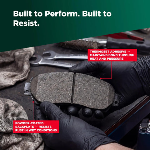 Mechanic holding Ceramic Rear Disc Brake Pad Set for Chevrolet Camaro Daily Driver with focus on thermoset adhesive and backplate.