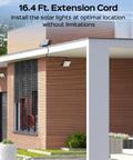 Super Bright Solar Outdoor Flood Lights 202 LEDs With 16.4 Ft Cable shown mounted on modern house