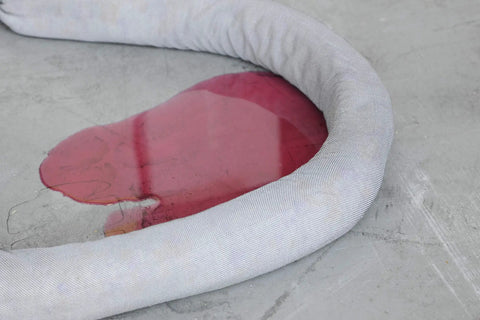 Universal Spill Containment Socks 3 x 48 Inches 2 Pack For Oil Water And Chemicals Absorbs Motor Oil Coolant Hydraulic Fluid Solvents And Water Fast Acting Durable Absorbent And Versatile Spill Response, white sock around red liquid spill