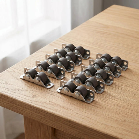 10 Pack Heavy Duty Mini Furniture Casters That Roll Like A Dream With Silent TPE Pads For Tool Benches Cabinet Drawers And Office Desks on wooden surface.