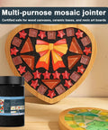 Black Quick Dry Crystal Tile Grout For Crafts Ready To Use Caulking Agent for Diy Glass Art and Mosaic Kit Supplies Handmade Gifts 1000g No Water Mixing Easy Set And Quick Apply, shown next to heart-shaped glass mosaic art.