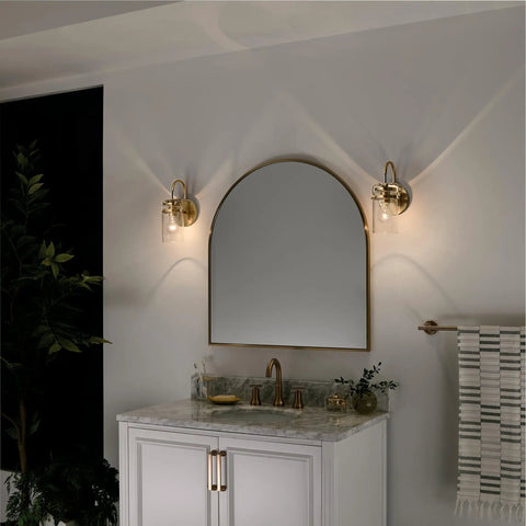 Brinley 11.5 Inch Wall Sconce In Champagne Bronze With Clear Glass Mason Jar Look above bathroom vanity mirror