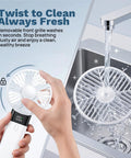 Handheld USB Rechargeable Fan With 3000mAh Battery Portable Mini Personal Fan grille being cleaned under water