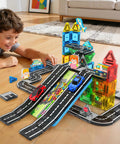Child playing with Mini Magnetic Tiles Road Travel Set For Kids On The Go Portable STEM Sensory Building Blocks on floor