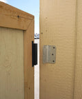 AM3 RM100C Magnet Catch Industrial Type with Mounting Holes Powder Coated Black Finish installed on gate