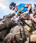 Cyclist navigating rocky trail with Flat Bar MTB Stem Mount For A Clean Cockpit One Accessory At A Time Mount A Computer Camera
