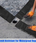 Two Rolls Asphalt Crack Filler Tape, 3.15 Inch Wide, 50 Feet Each being applied to a road surface by a person in gloves