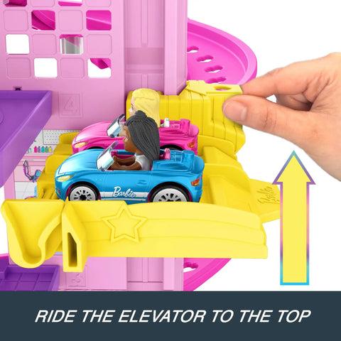 Close-up of RacerVerse Barbie Spiral Track Set with Barbie Malibu and Barbie Brooklyn cars on yellow elevator track.
