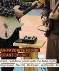 Two guitarists using Zenith 2 USB C Audio Interface For Guitar, Vocals, Streaming And Podcasting on wooden stand outdoors.