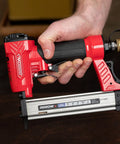 Hand holding Lightweight 23 Gauge Pin Nailer Oil Free Pneumatic Tool PT23G Accepts Nails From Three Eighths To One Inch