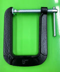5 Inch Deep Throat U Clamp With About Two To Three Quarter Inch Jaw Opening And Five And A Half Inch Throat Depth, Malleable Steel Construction, Powder Coat Finish For Rust Resistance, Sliding T Handle For A Tight Grip, Lightweight 1.6 Lb. 5-inch U-clamp on green background, front view