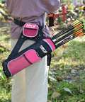 Person wearing pink Archery Hip Quiver With Three Detachable Arrow Tubes outdoors, featuring adjustable nylon pockets.