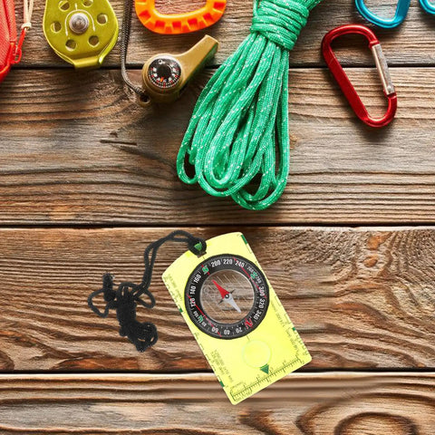 Orienteering Compass High Precision Acrylic Navigation Tool for Survival and Camping on wooden surface with hiking gear