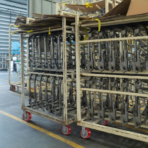 Factory carts with stacked metal parts on Heavy Duty 5 Inch Caster Wheels Replacement 1000 Lbs Per Wheel Beefed Up Polyurethane On Cast Iron Wheel Half Inch Bore Setup For Push Carts Platform Trucks 4 Pack