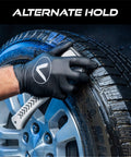 Person using Ergonomic Tire And Wheel Cleaning Brush For Cars, 10.3 Inch Long With Short Stiff Bristles on a car tire for detailing.