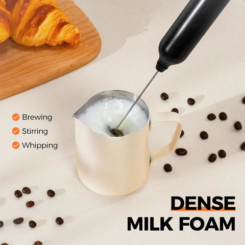 Rechargeable Handheld Milk Frother With USB Type C 3 Speed Adjustable Foam Maker whipping milk in a white jug on a table