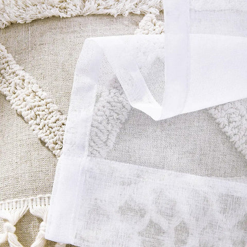 Close-up of white sheer curtains showing semi crinkle texture and rod pocket design, 63 inch length window treatments for privacy and breeze