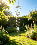 Spiral Tail Wind Spinner Gazing Ball For Indoor Outdoor Decor, 13 Inch Light Blue Crystal Glass Ball With Stainless Steel Frame, Hanging Swivel Hook, Durable Sparkle Ornament For Yard Or Patio That Pops hanging in a sunny garden