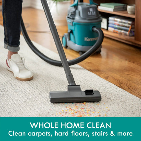 Person using Wet Dry Canister Vacuum Cleaner 3.2 Gallon With 2.5 Peak HP Motor on carpet, showcasing suction power in home setting.