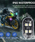 Close-up of IP65 waterproof Upgraded 4 LED Wireless Strobe Lights with colorful lights on motorcycle in rain
