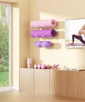 Garage Gym Must Have Space Saving 3-Tier Wall Mount Yoga Mat Rack for mats, foam rollers and gear in home gym.
