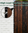 Heavy Duty Wall Mount Gate Hinges Two Pack Built Tough For Farm Gates And Chain Link Fence Gates With Five Eighth Inch Hinge Pin Up To Six Hundred Pound Capacity Screws Included Galvanized Iron Construction installed on wooden gate.