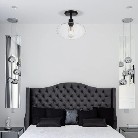 Bedroom with Semi Flush Mount Ceiling Light With Clear Glass Shade Modern Vintage Vibe Fixture above black tufted headboard.