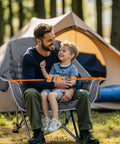 Father and son sitting on Two Pack Oversized Heavy Duty Camping Chairs Padded And Foldable With Cup Holder outdoors