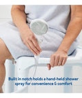 Person sitting on Heavy Duty Bath Seat and Shower Chair for Inside Tub, holding a shower spray, highlighting the notch feature.