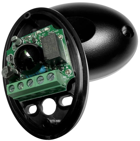 Close-up view of infrared beam sensor for automatic sliding garage doors, showing internal components and black casing.