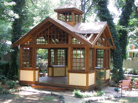 Garden gazebo with wooden lattice detailing treated with All In One Exterior Wood Stain And Sealer For Outdoor Decks And Fences No Back Brushing Needed No Fuss Easy To Apply Waterproof Sealant With UV Protection Rich Pecan Finish In 1 Gallon No Priming Required.