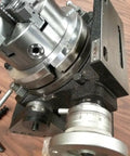 Precision Tilting Rotary Table With Six Jaw Self Centering Chuck For Dead Nuts Angular Control And Clean Sweeps On Cnc Or Manual Mill Rigs Gear Drives Zero To Ninety Degrees For That Top Shelf Accuracy, showing detailed gear adjustment.