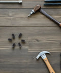 Kickass Stainless Steel Ball Plunger Screws With Hex Socket Fasteners arranged on a wood surface with various tools.