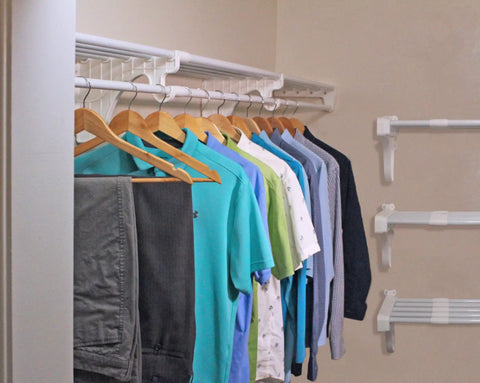 Expandable Closet Shelf And Hanging Rod System Adjustable From 17.5 To 27 Inches White Finish Holds Up To 200 Lbs displayed with clothes