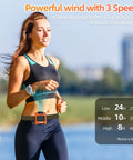 Woman jogging with Waist Clip Fan With 10000mAh Battery, Rechargeable Belt Clip Cooler Delivers 24 Hour Runtime visible on waist.