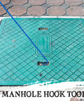 Beefy 30 Inch Heavy Duty Manhole Cover Hook With Three Eighths Inch Steel Handle lifting a manhole cover