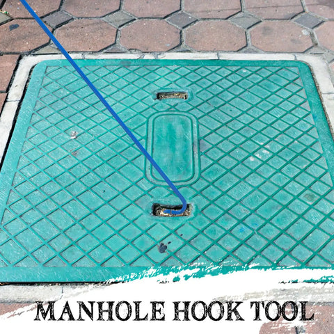 Beefy 30 Inch Heavy Duty Manhole Cover Hook With Three Eighths Inch Steel Handle lifting a manhole cover