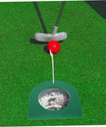 Putting a red golf ball into a green cup of the 2 Pack Portable Golf Putting Cup Practice Set With Continuous Ball Return For Indoor Training And Travel