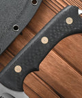 Close-up of Rugged AUS 10 Fixed Blade Knife With Carbon Fiber Handle, highlighting textured grip and sheath corner