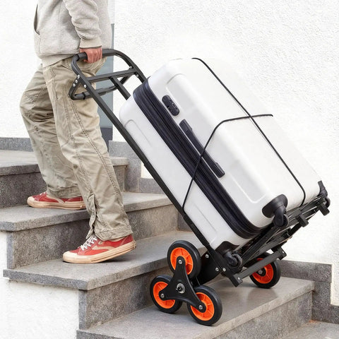 Person using Stair Climbing Dolly with Telescoping Handle 460 lb capacity cart, six wheels, carrying suitcase upstairs