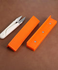 2 Set Magnetic Vise Jaw Pads 5 Inch Soft Rubber for use with delicate tools and materials on a leather surface.