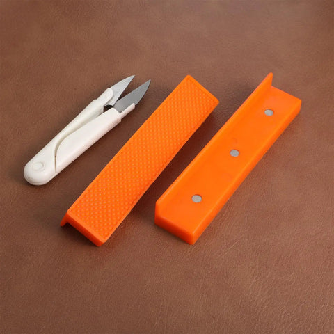 2 Set Magnetic Vise Jaw Pads 5 Inch Soft Rubber for use with delicate tools and materials on a leather surface.