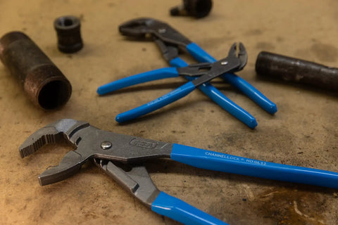 GripLock Tongue And Groove Pliers Set 6.5 Inch, 9.5 Inch, 12.5 Inch Water Pump Pliers with blue handles on a workshop table