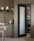 Kitchen pantry featuring 32 By 80 Black Door Slab With Frosted Glass Interior Panel In Solid Finished Shaker Style With Open Doorway