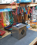 Portable Solder Smoke Fume Extractor For Soldering, Jewelry Making, And Crafting on a cluttered workbench