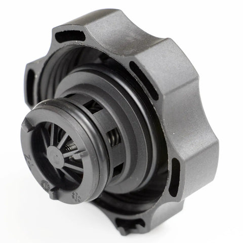 Close-up view of a black universal GM radiator surge tank cap for Chevy GMC Buick Cadillac Pontiac Saturn.