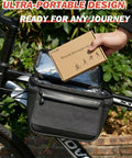 Hand holding All-In-One Bike Tire Repair Kit For Mountain Road And Commuter Bikes with pouch on bicycle.