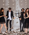 Party backdrop with 8 Pack Mini Disco Ball Garlands And Silver Mirror Balls Hanging Banner For Party Backdrop Decor Sparkly Silver Streamer Curtains.